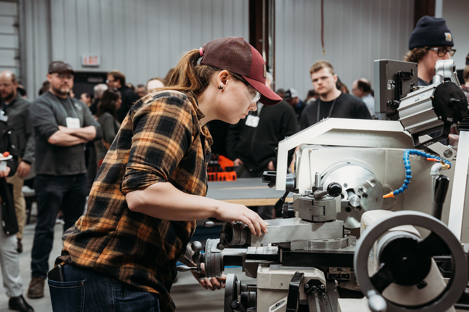 Krista Tyo-Hollingshed, SLC Skills Start participant, provides a demonstration at the machine shop opening in Cornwall on April 14